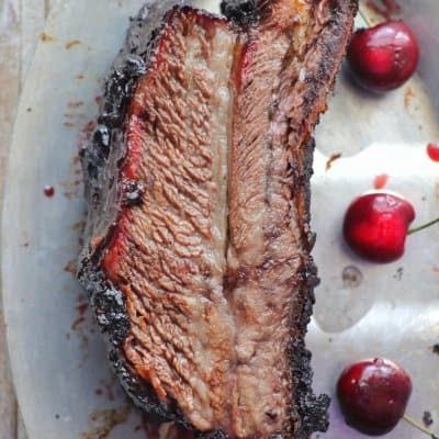 Grilled Beef Rib on a platter with Black Cherry Cola Glaze