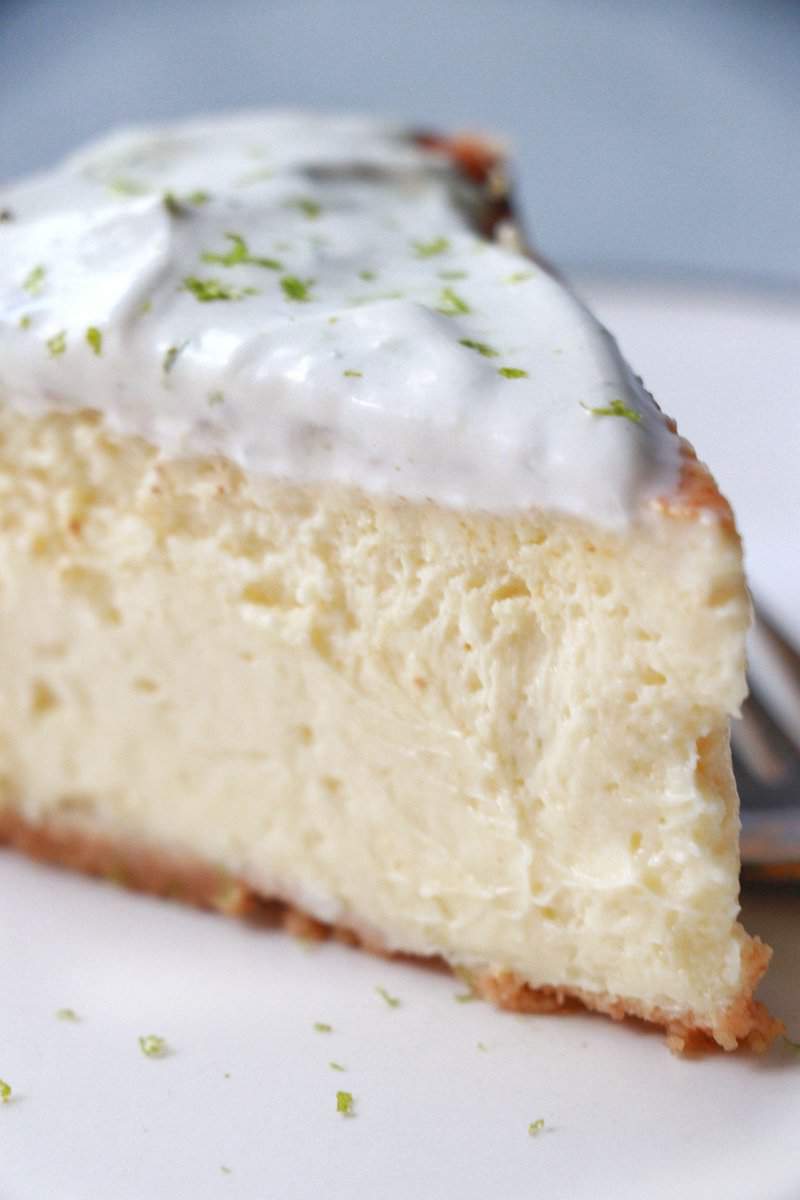 Close up of a slice of Key Lime Cheesecake on a plate