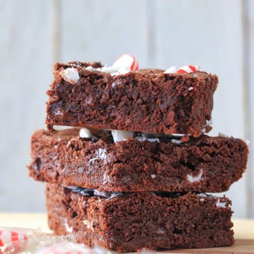 Peppermint Brownies stacked on top of each other.