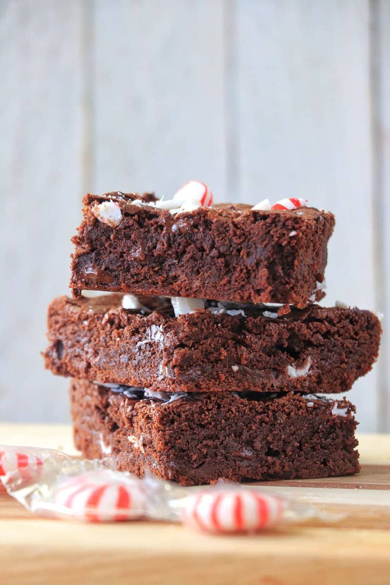 Peppermint Brownies stacked on top of each other.