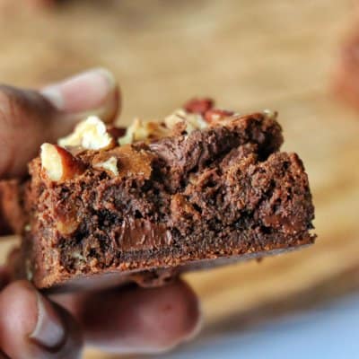 Triple chocolate brownies in a hand
