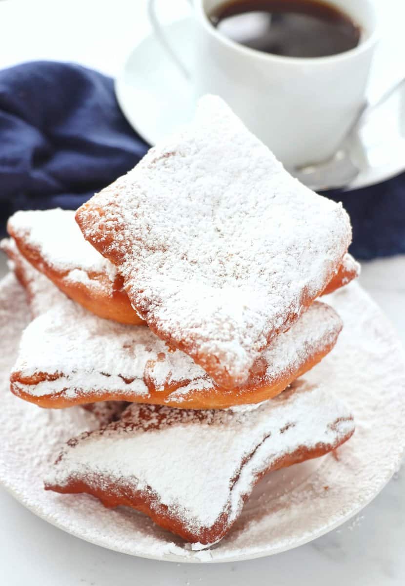Classic Beignets on plate with cup of coffee