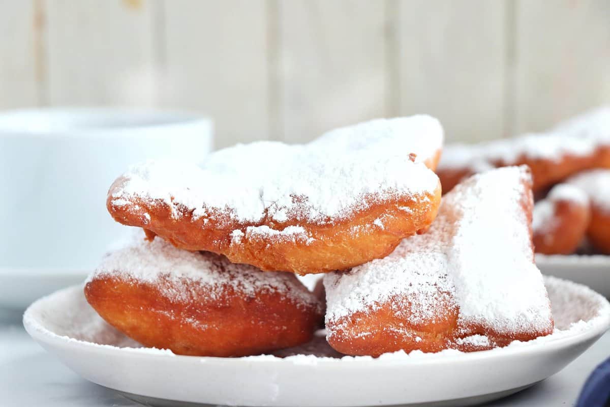 close up side view of Classic Beignets on plate 