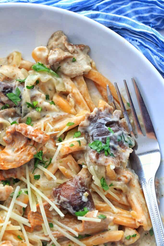 Close up picture of Cajun Mushroom Pasta with a fork.