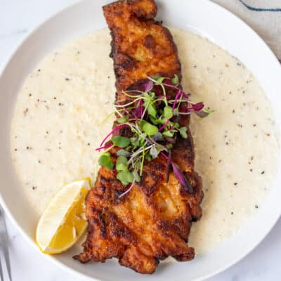 Cajun Fish and Grits on a plate