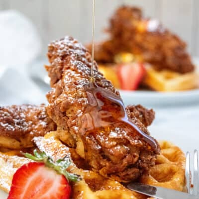 fried chicken and waffles with syrup pour