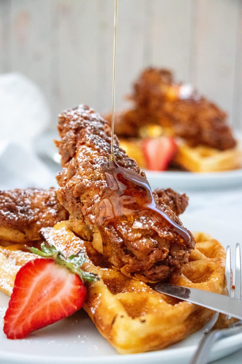 fried chicken and waffles with syrup pour