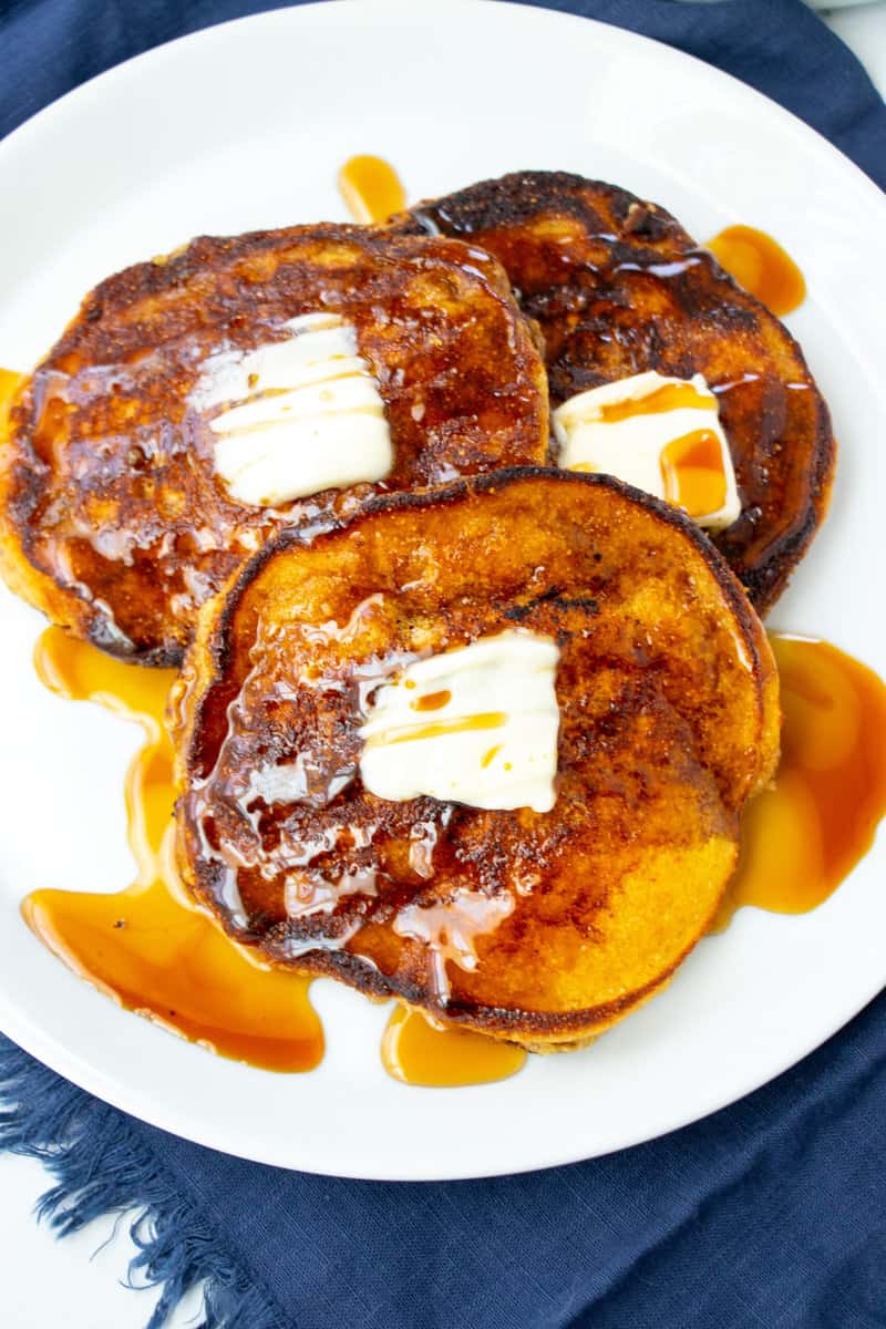 syrup and butter over hoecakes