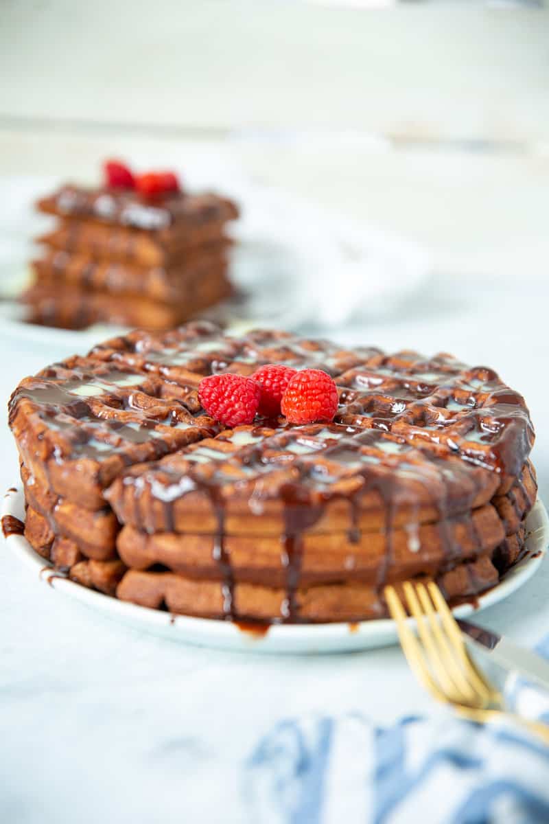 Stack of chocolate waffles on a plate