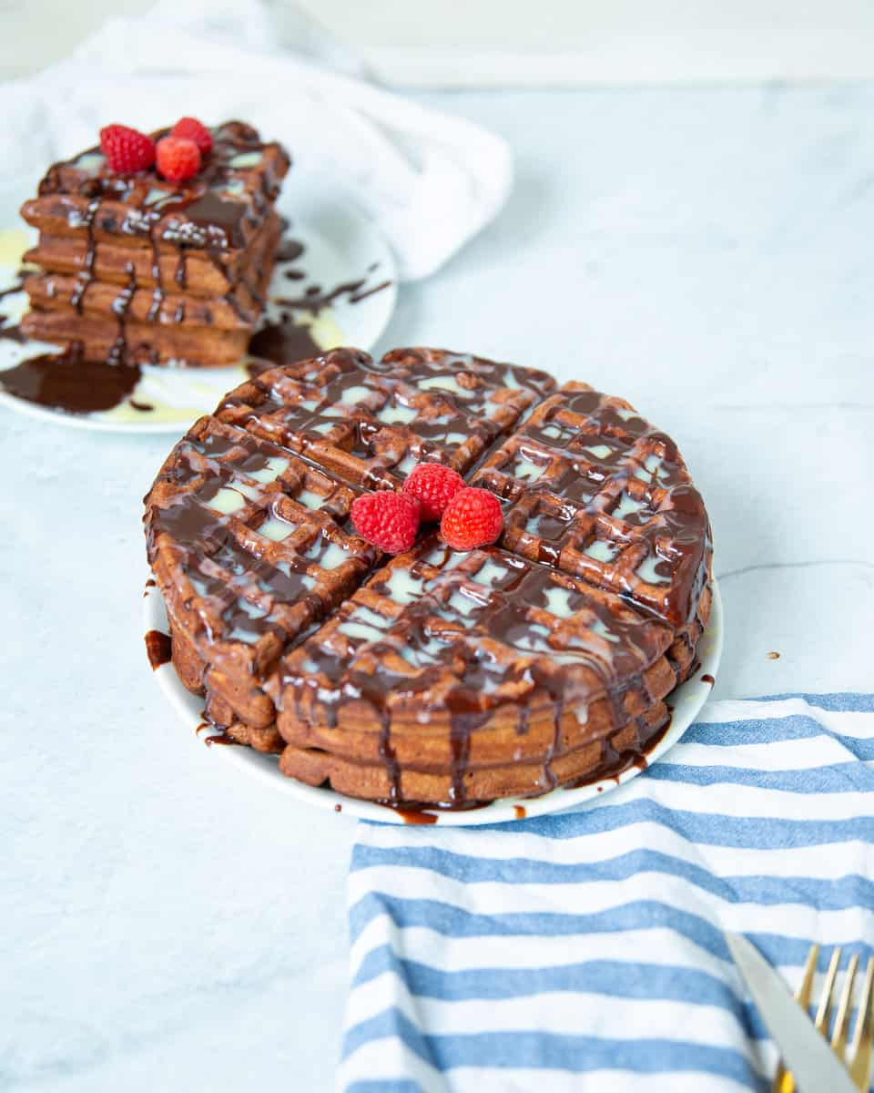 Stack of chocolate waffles on a plate