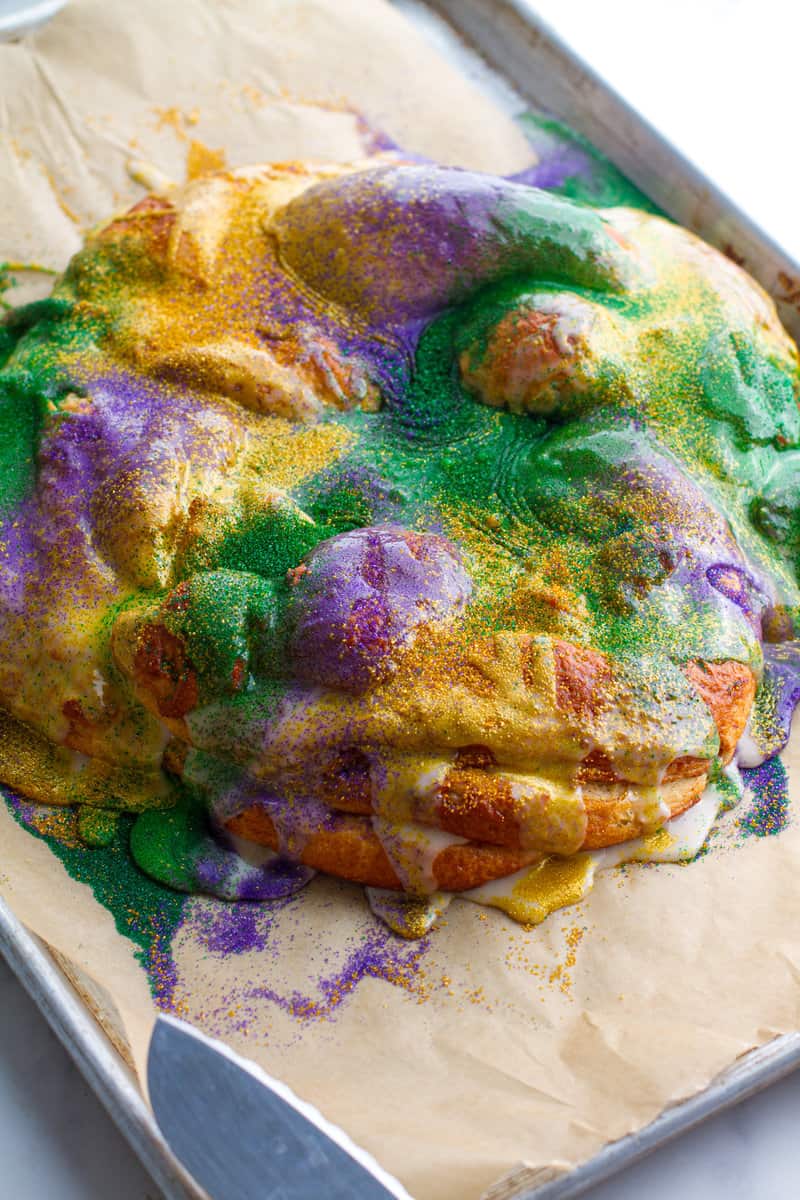 Whole king cake with Cream cheese filling on a baking sheet
