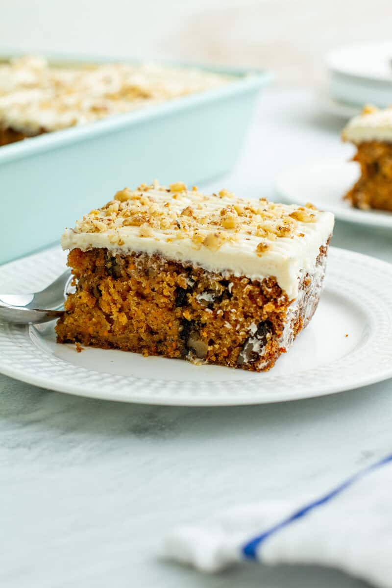 Carrot Walnut Cake on a plate with a spoon