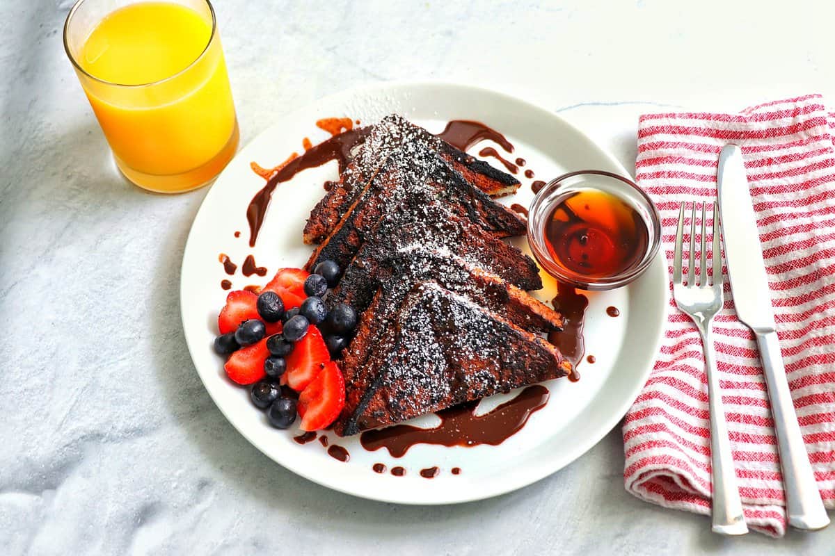 Chocolate French Toast with fork, knife and napkin