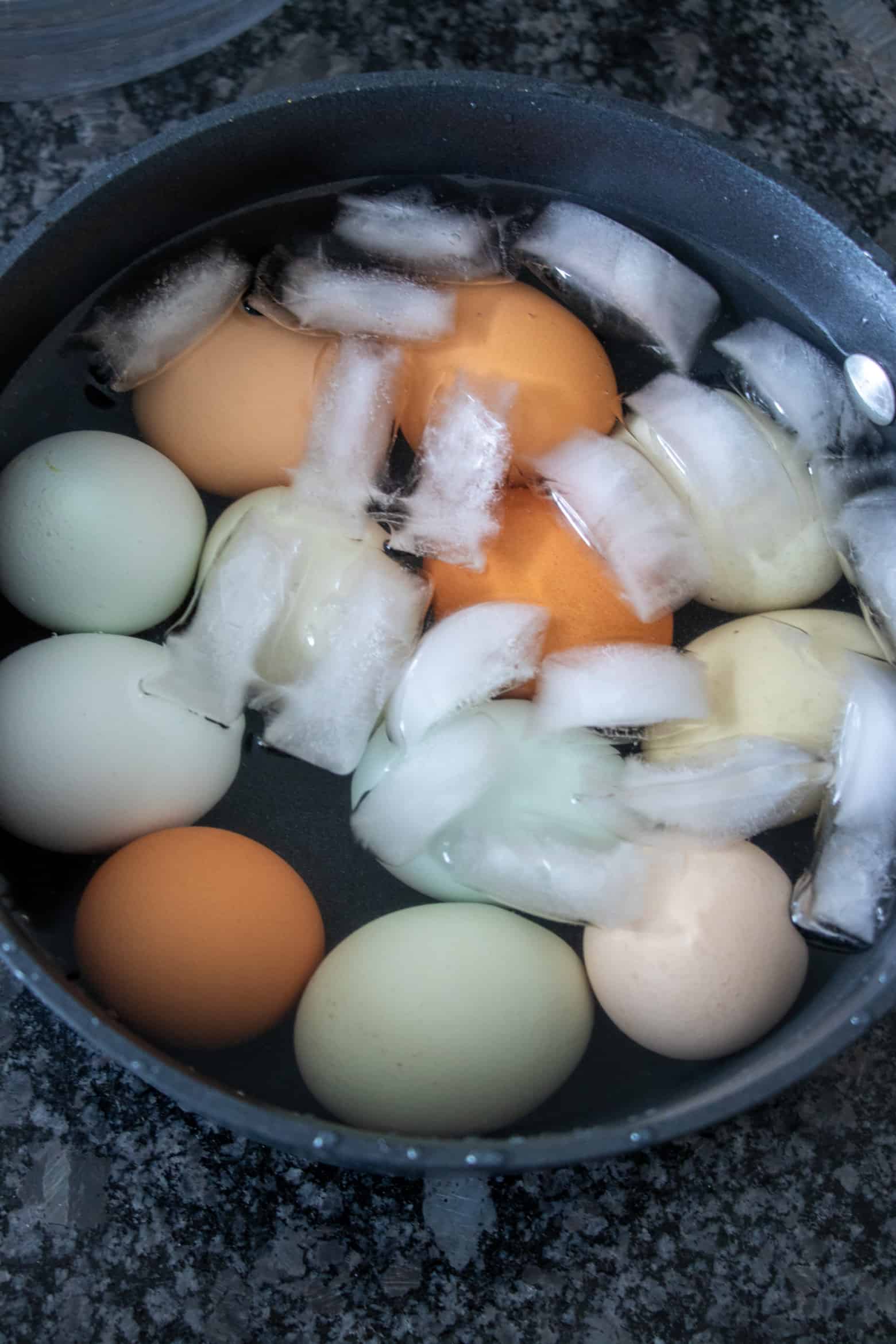 hard boiled eggs in a bowl of ice water.