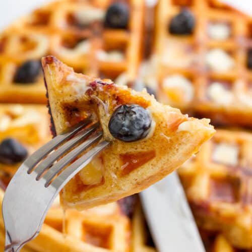 Blueberry waffles on a fork.