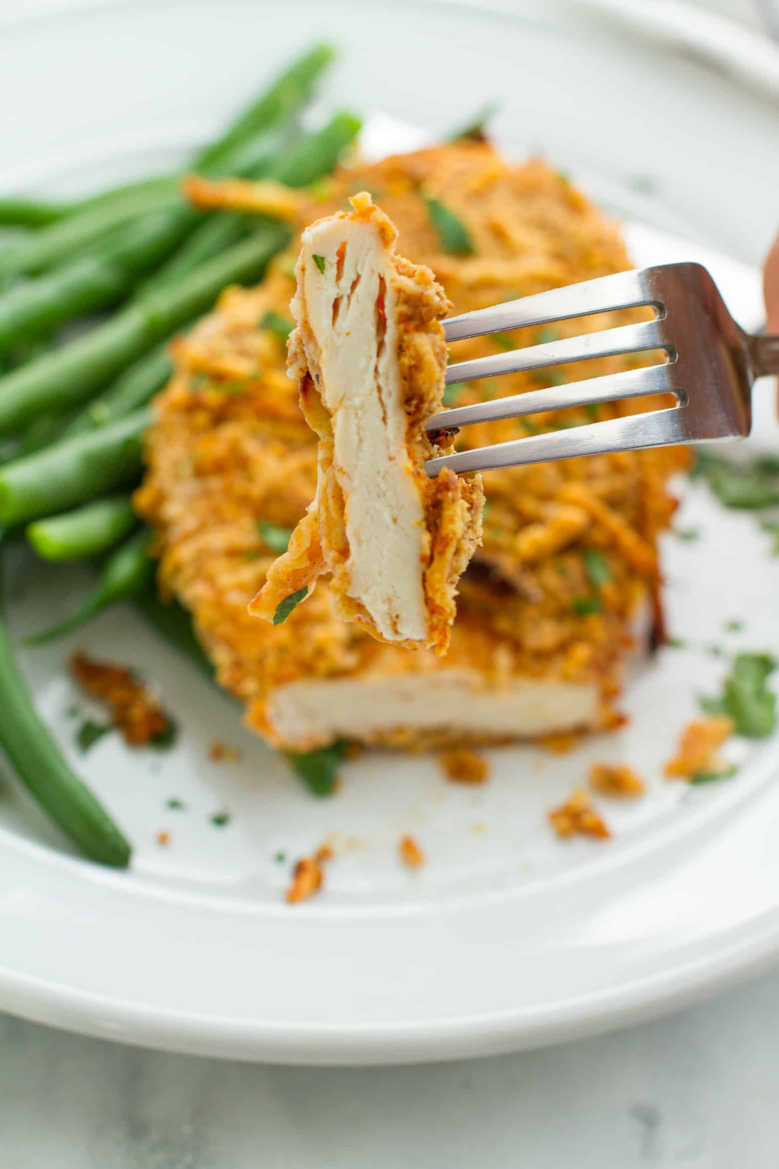 Parmesan Crusted Chicken (Air Fryer) sliced on a fork.