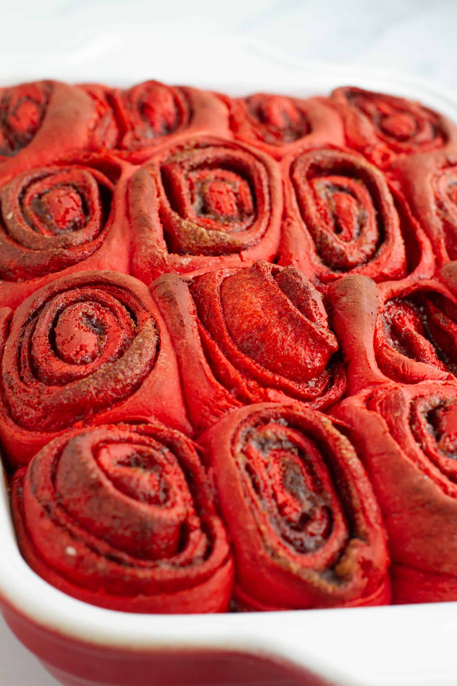 Baked red velvet cinnamon rolls with no icing.