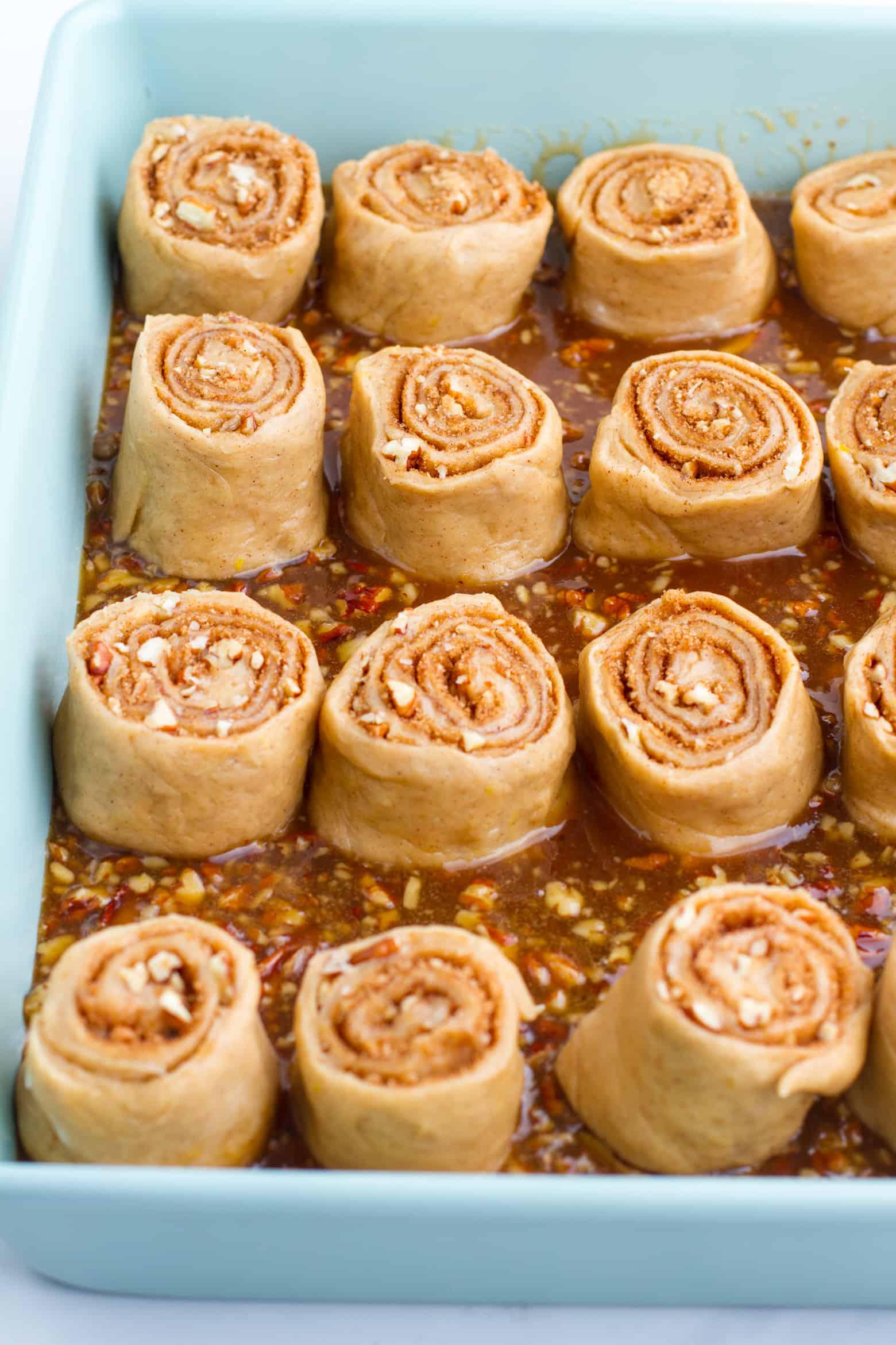 Sticky Buns in baking pan with sticky sauce.