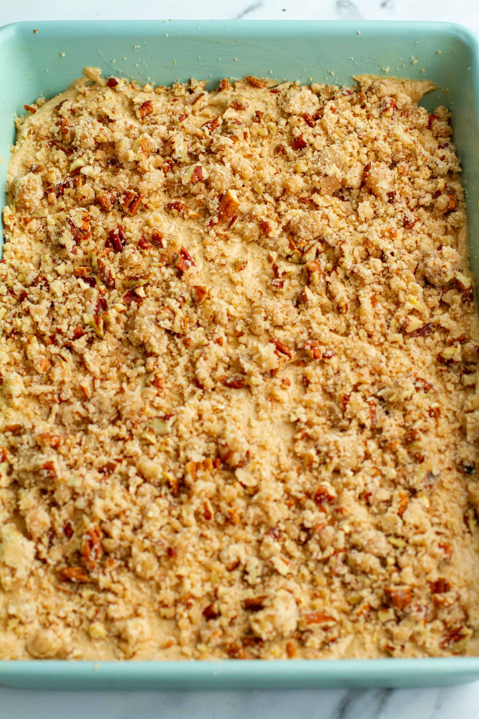 Cinnamon Coffee Cake final layer of pecan streusel before baking.