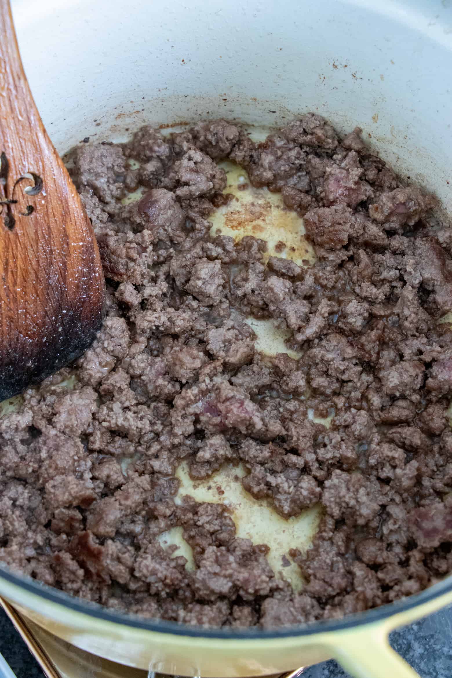 Ground beef cooking in a pot.