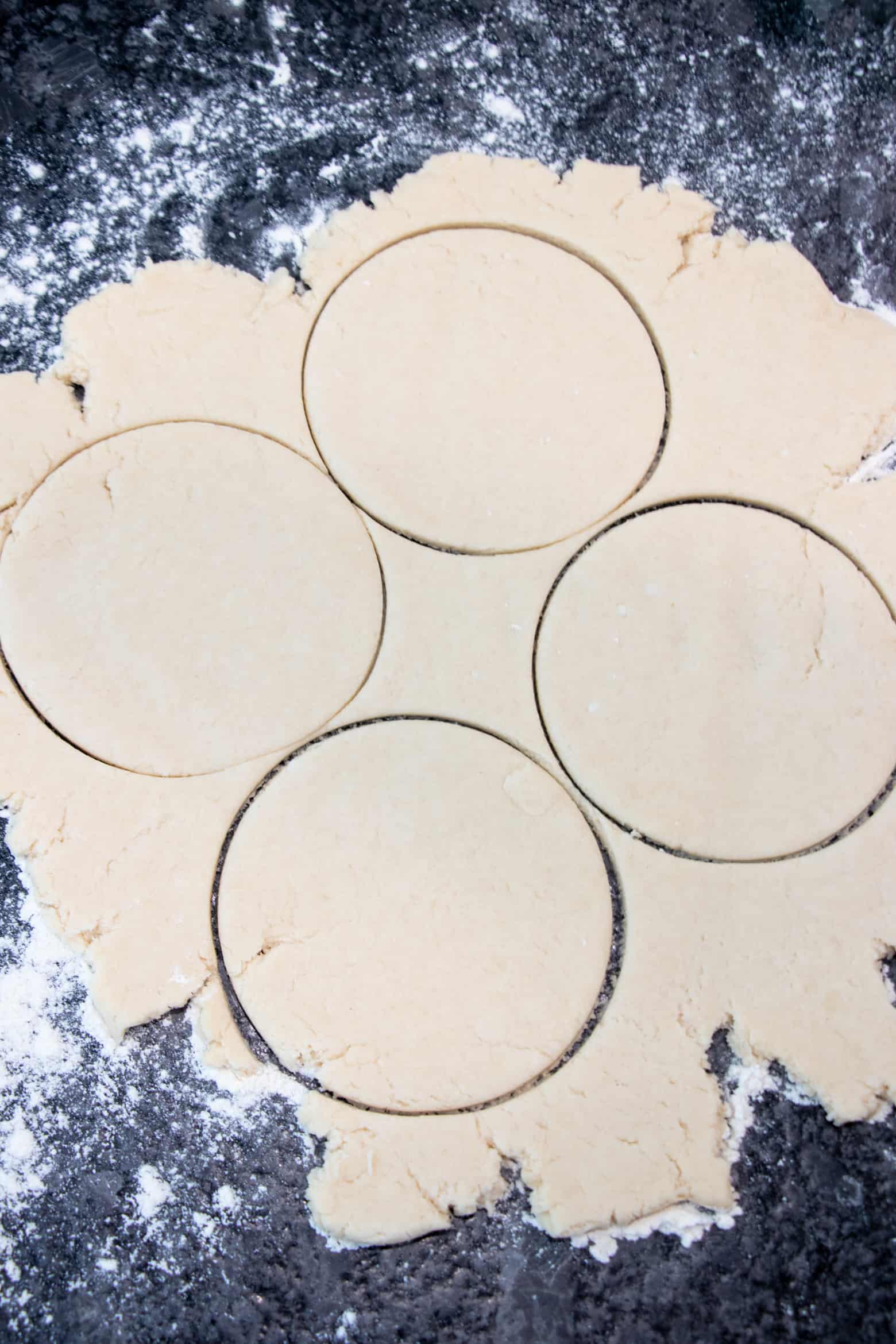 Rolled out pie dough, cut into small circles.