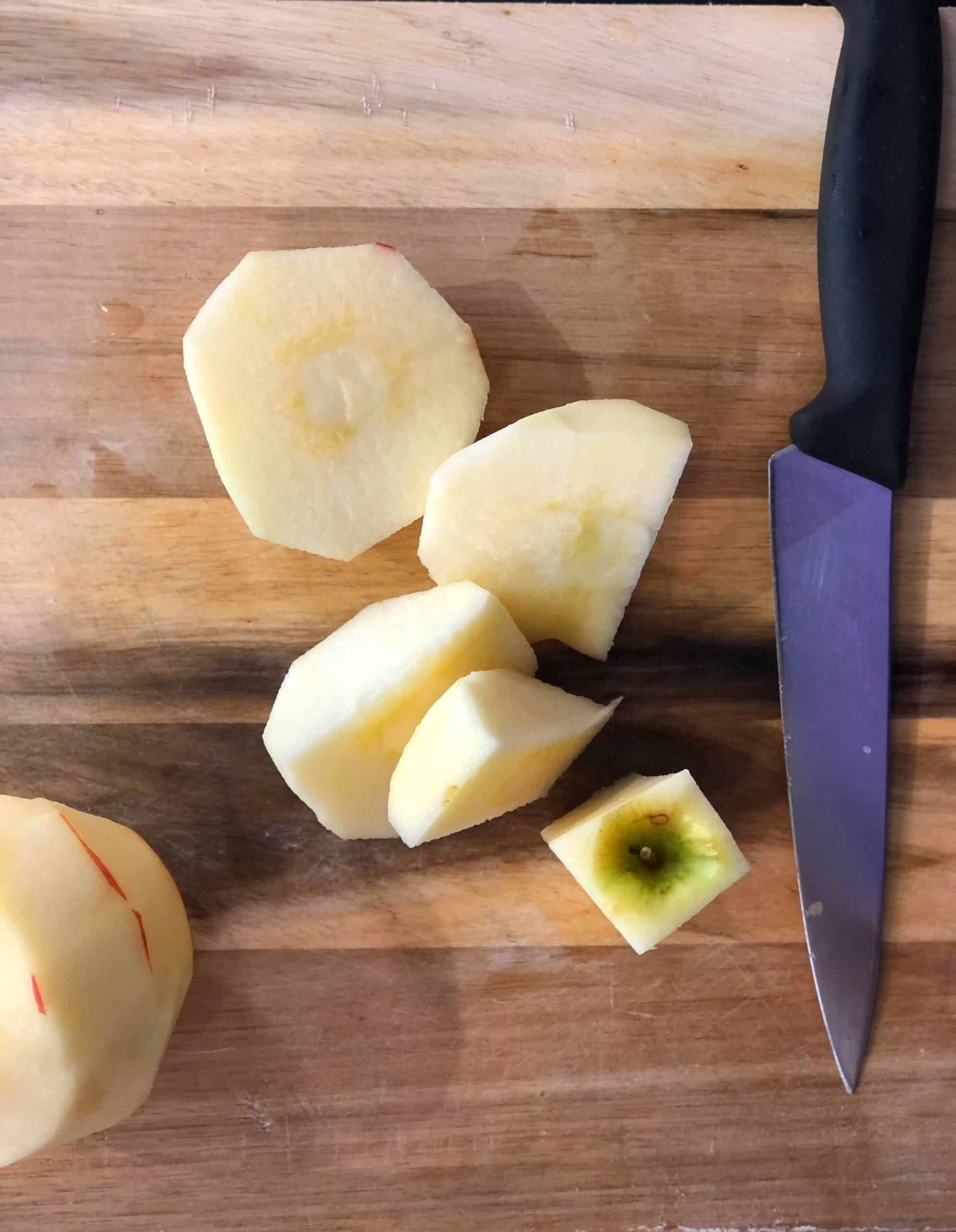 Sliced apples on a cutting board.