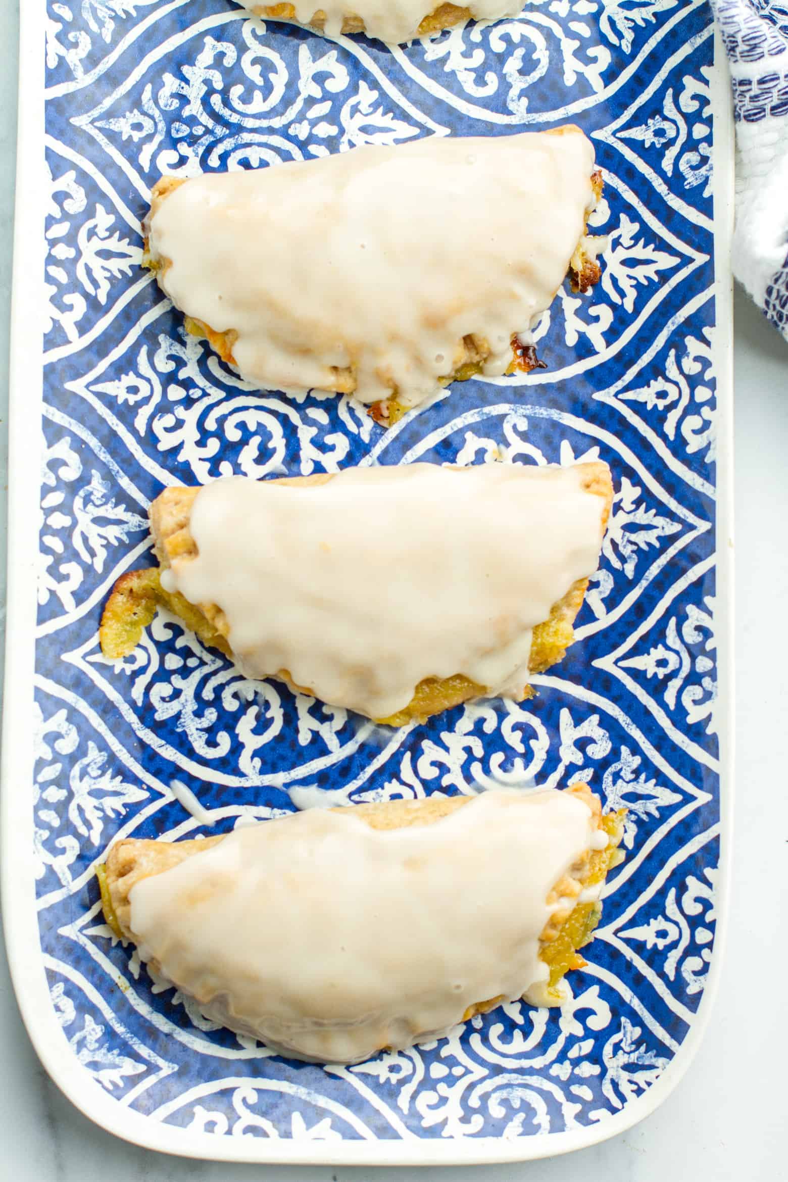 Iced Lemon hand pies on a platter.