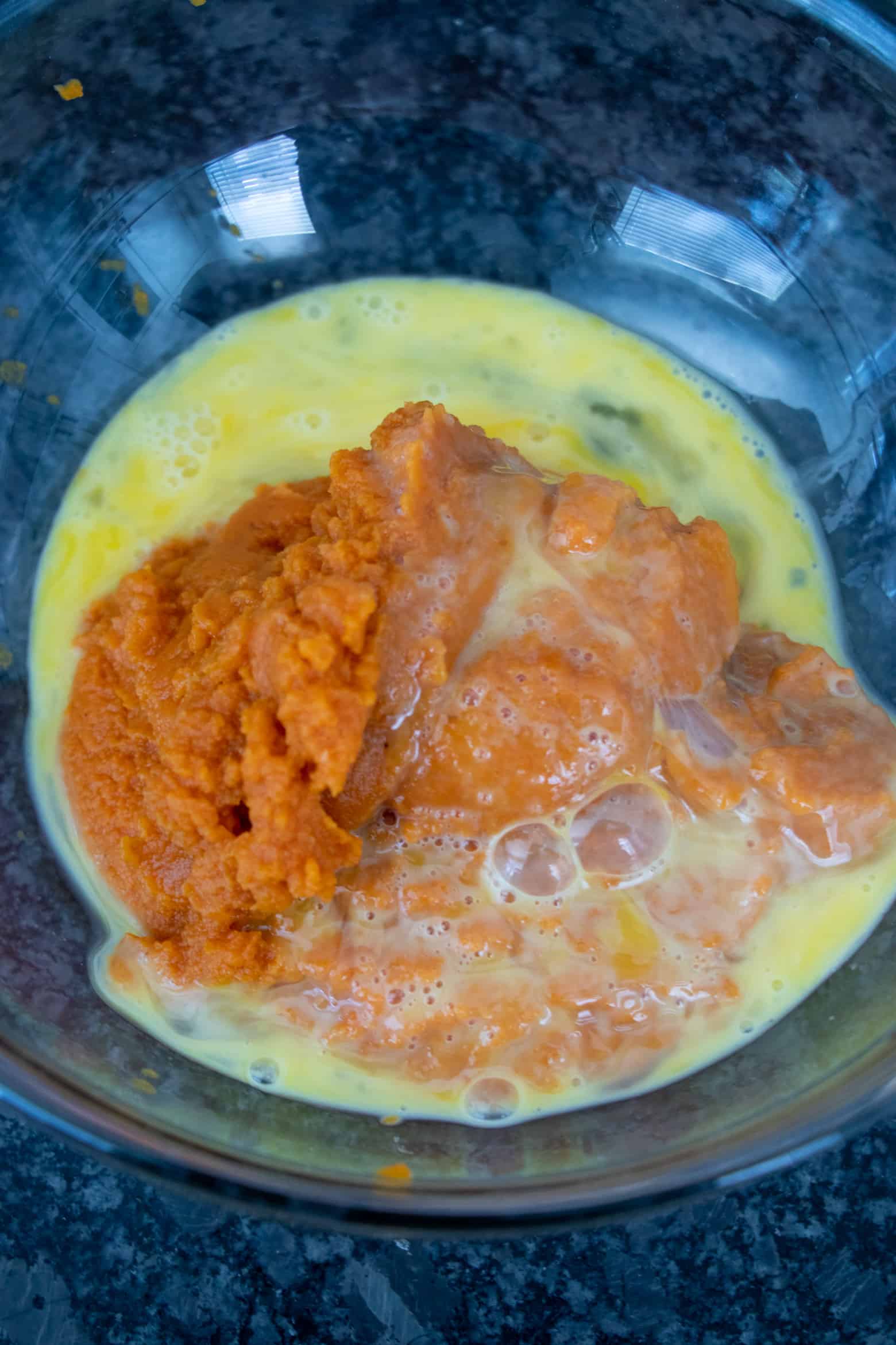 Pumpkin puree and egg in a bowl