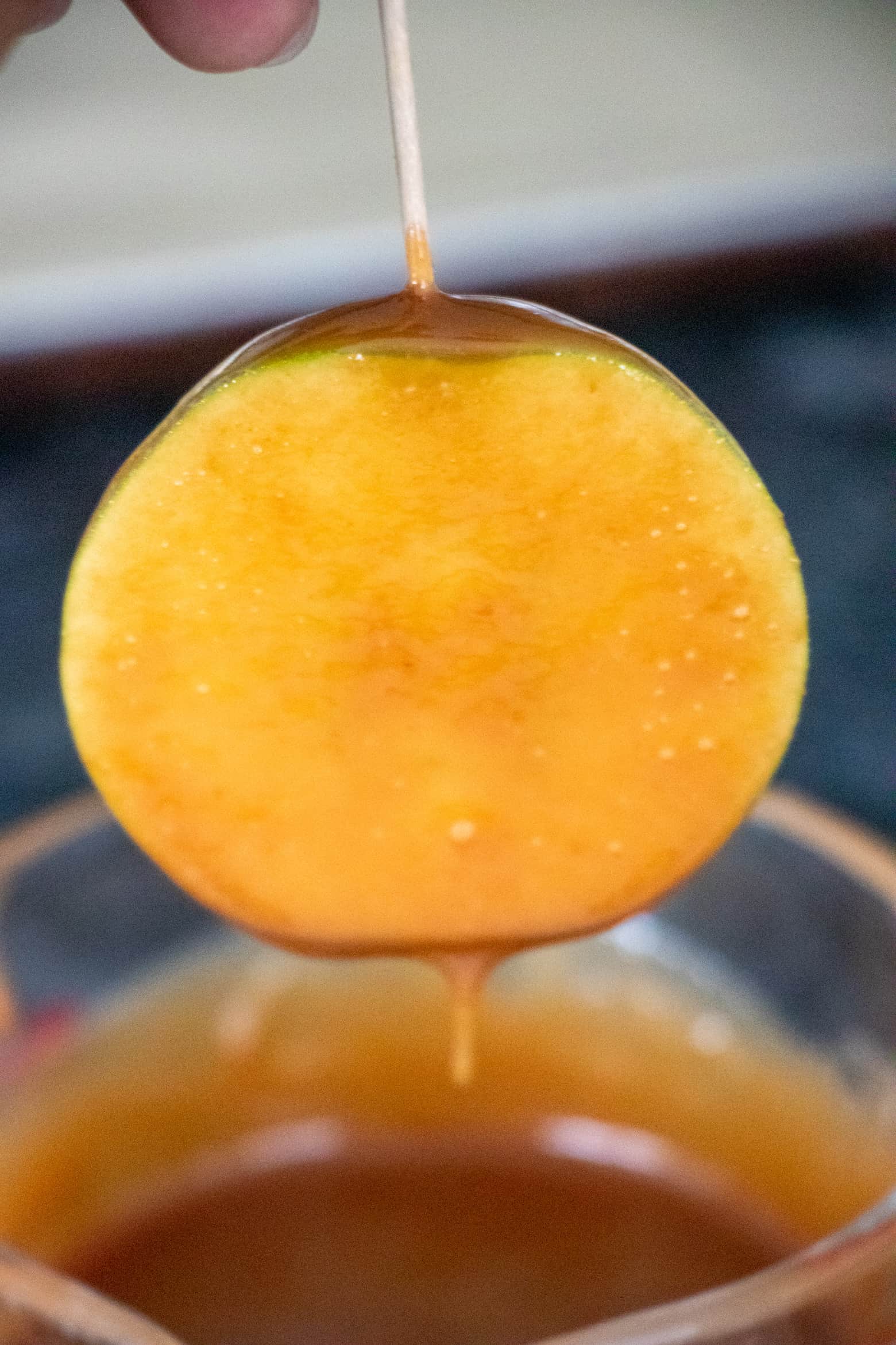 Apple sliced dipped in caramel sauce.