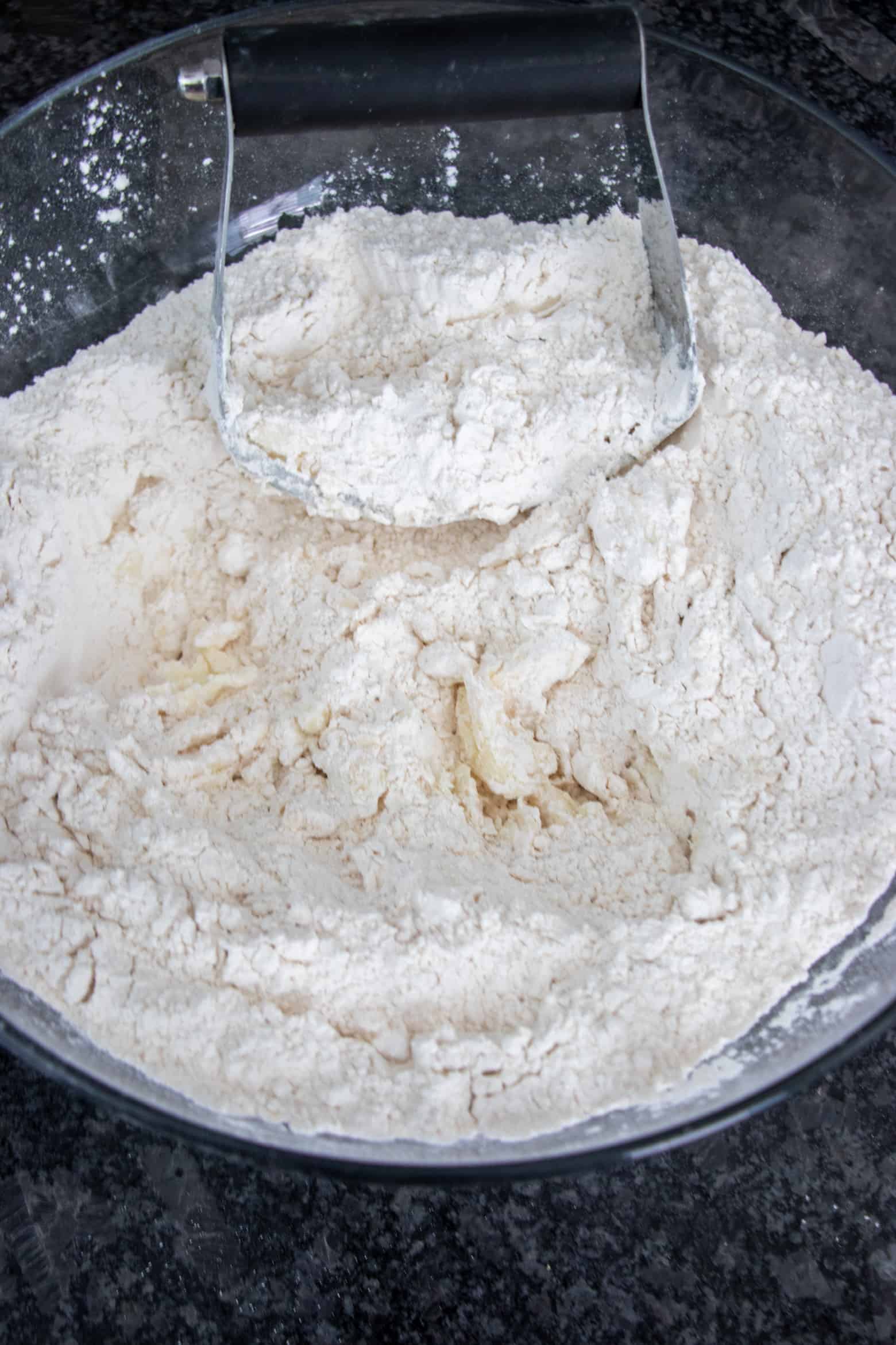 pie crust flour and shortening being mixed