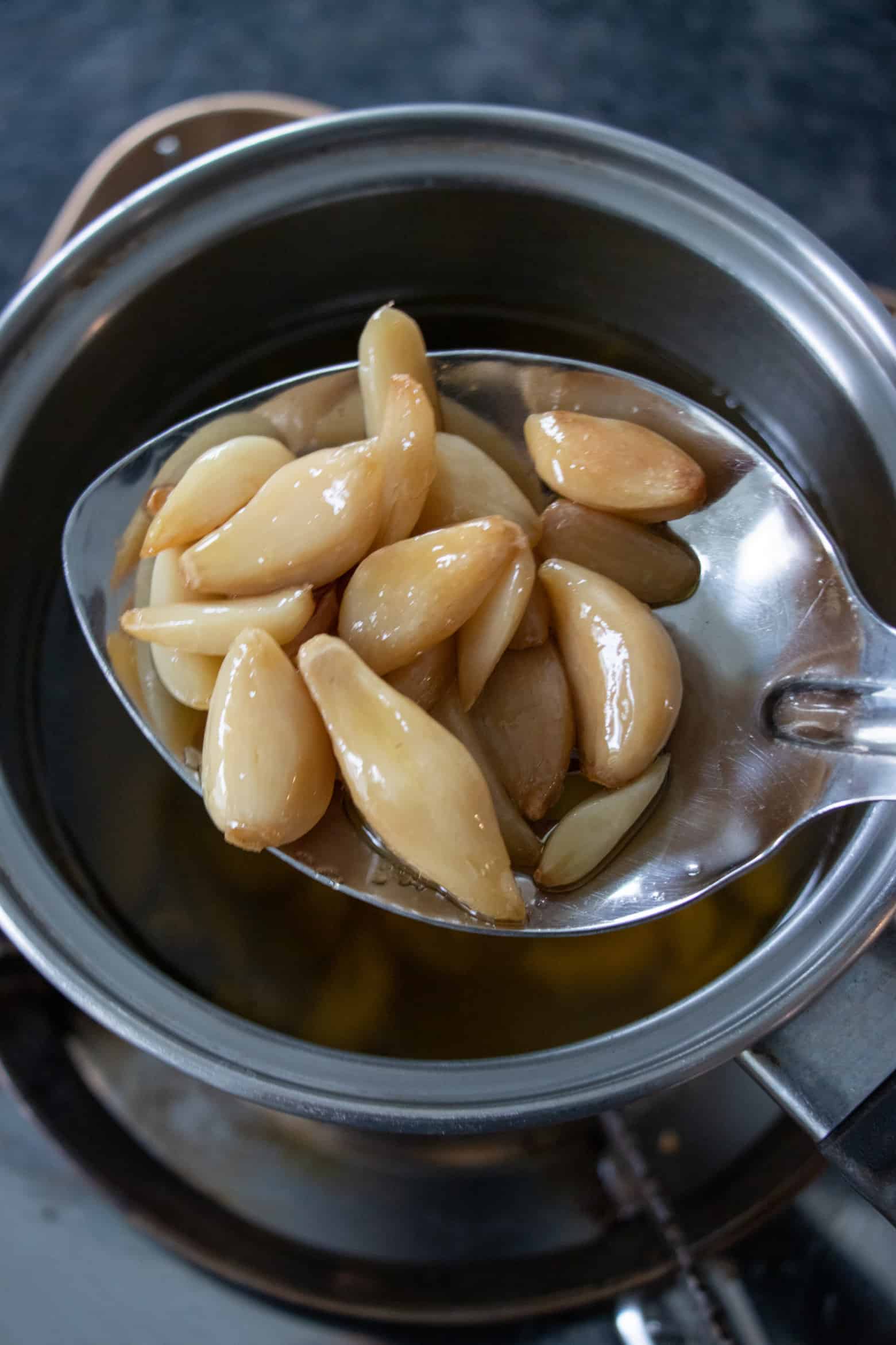 garlic confit in a spoon