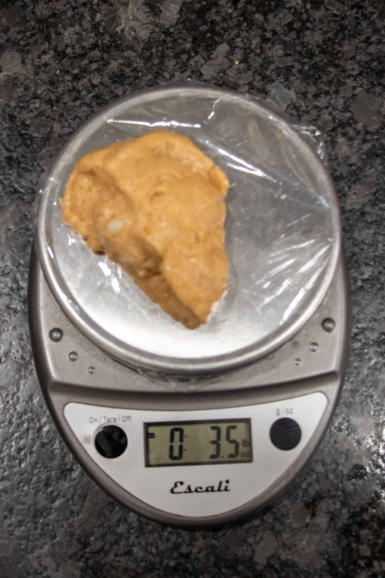 weighed dough on a scale to 3.5 ounces.