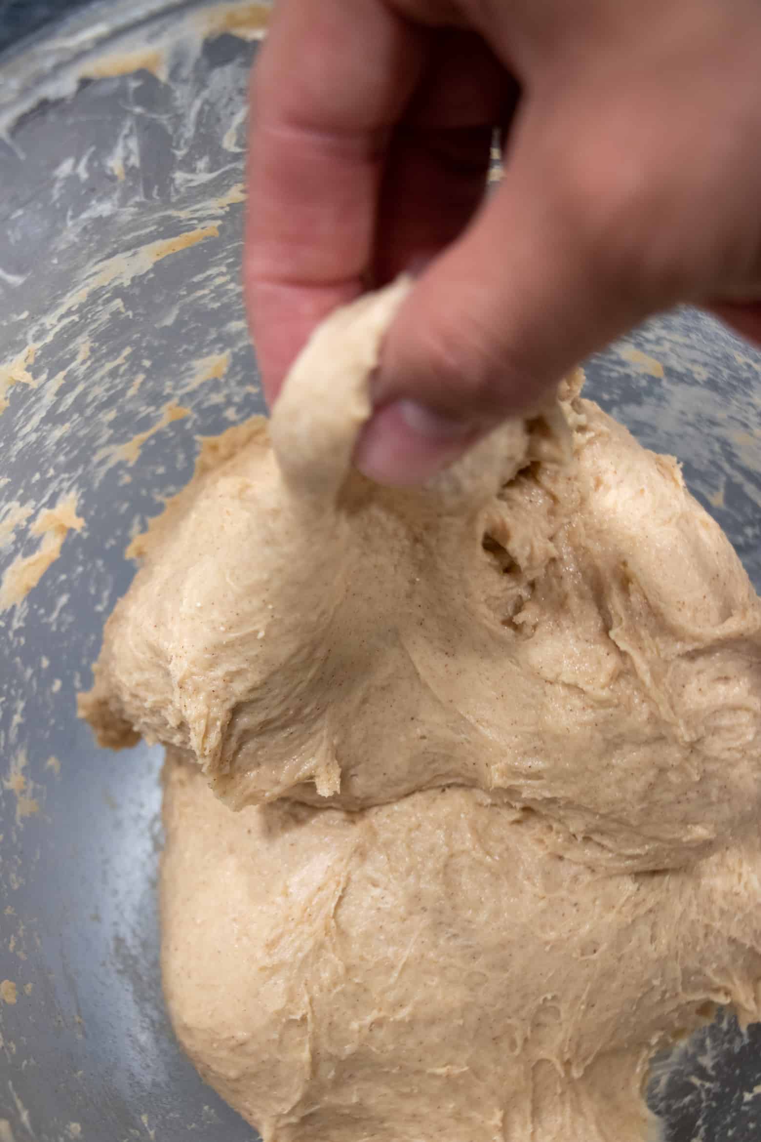finger showing correct texture for liege waffles dough