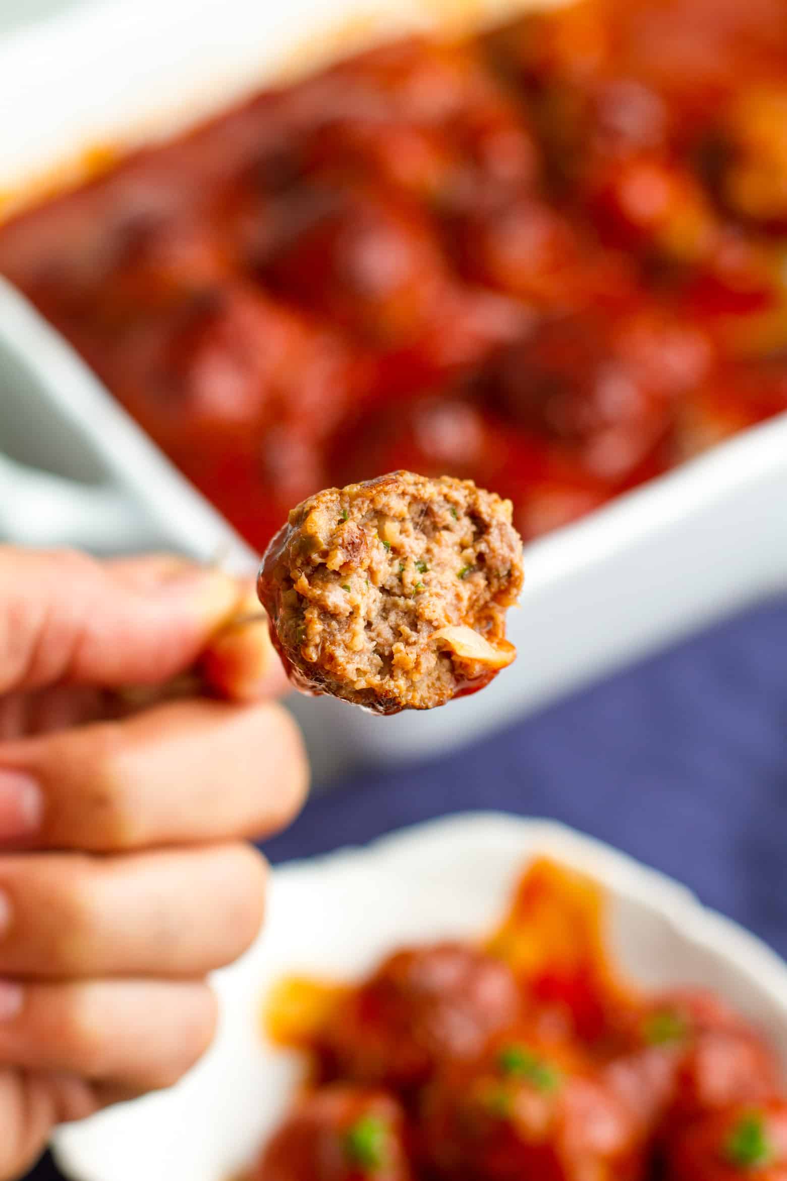 bbq meatball with a bite taken out.