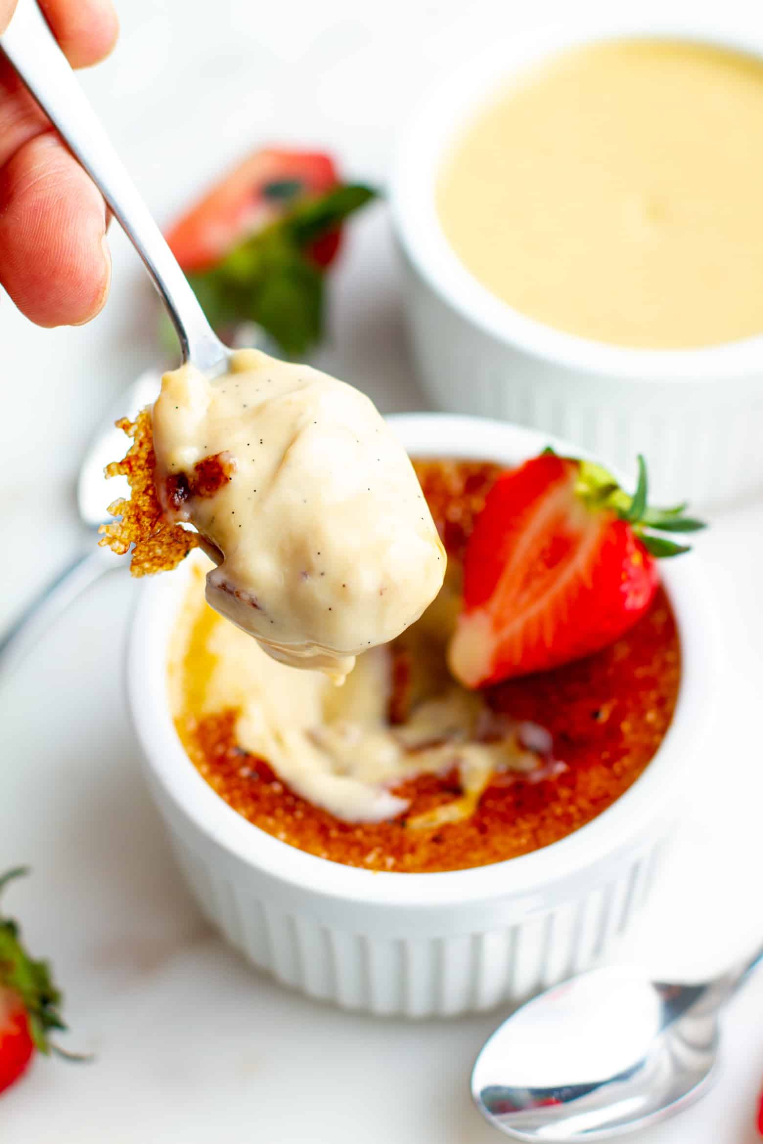 Strawberry Creme Brulee on a spoon.