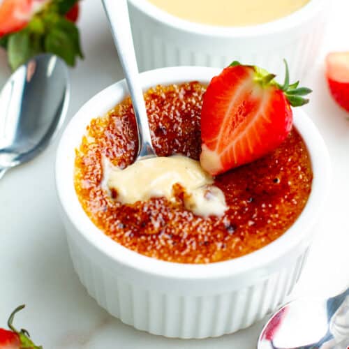 Strawberry Creme Brulee with a spoon inserted.