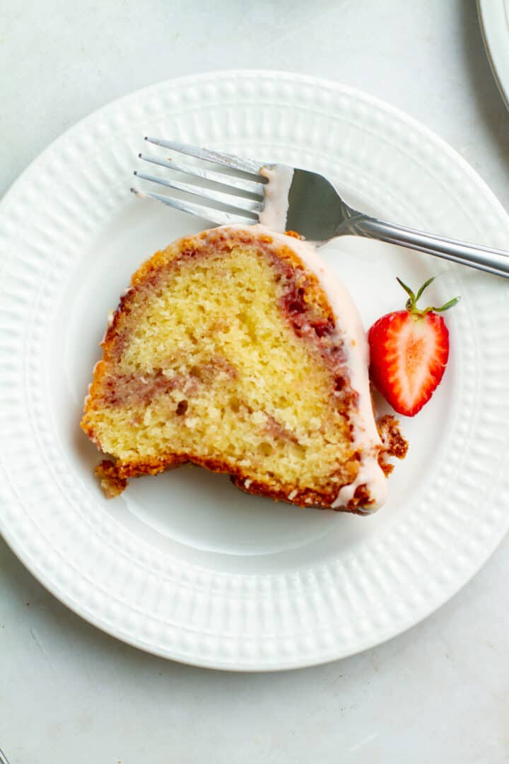 Slice of strawberry pound cake on a plate.