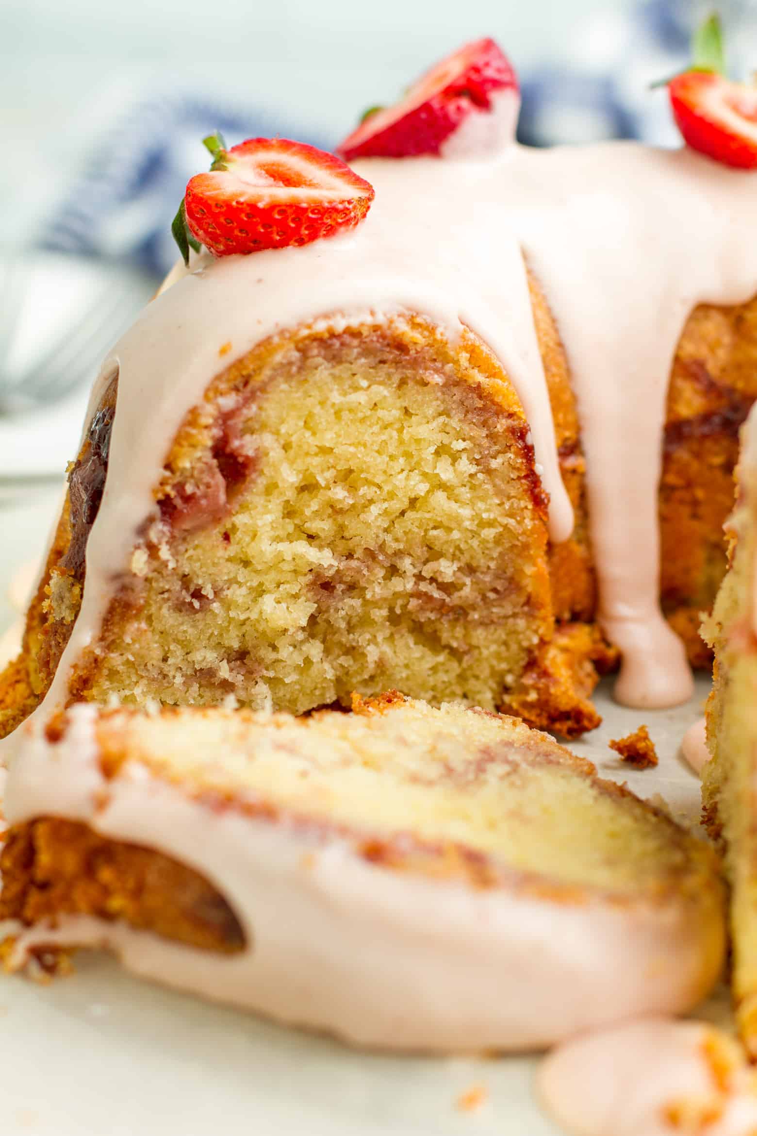 Strawberry pound cake with a slice laying next to it.