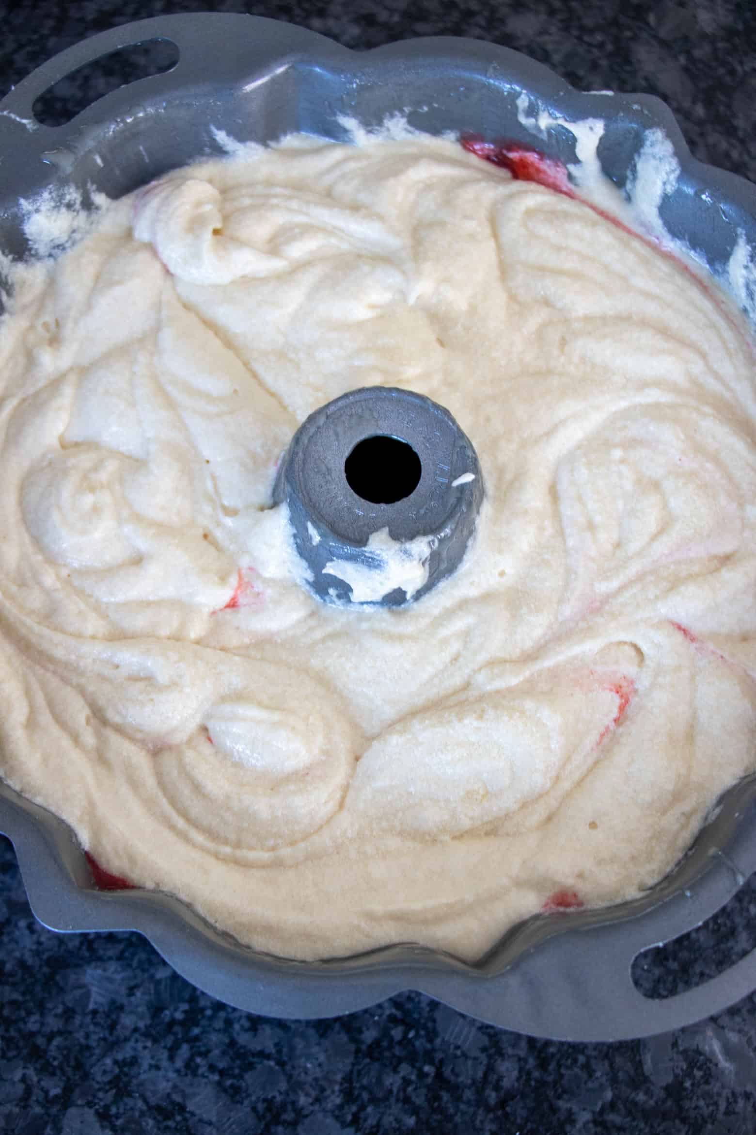 layered strawberry pound cake batter before baking.
