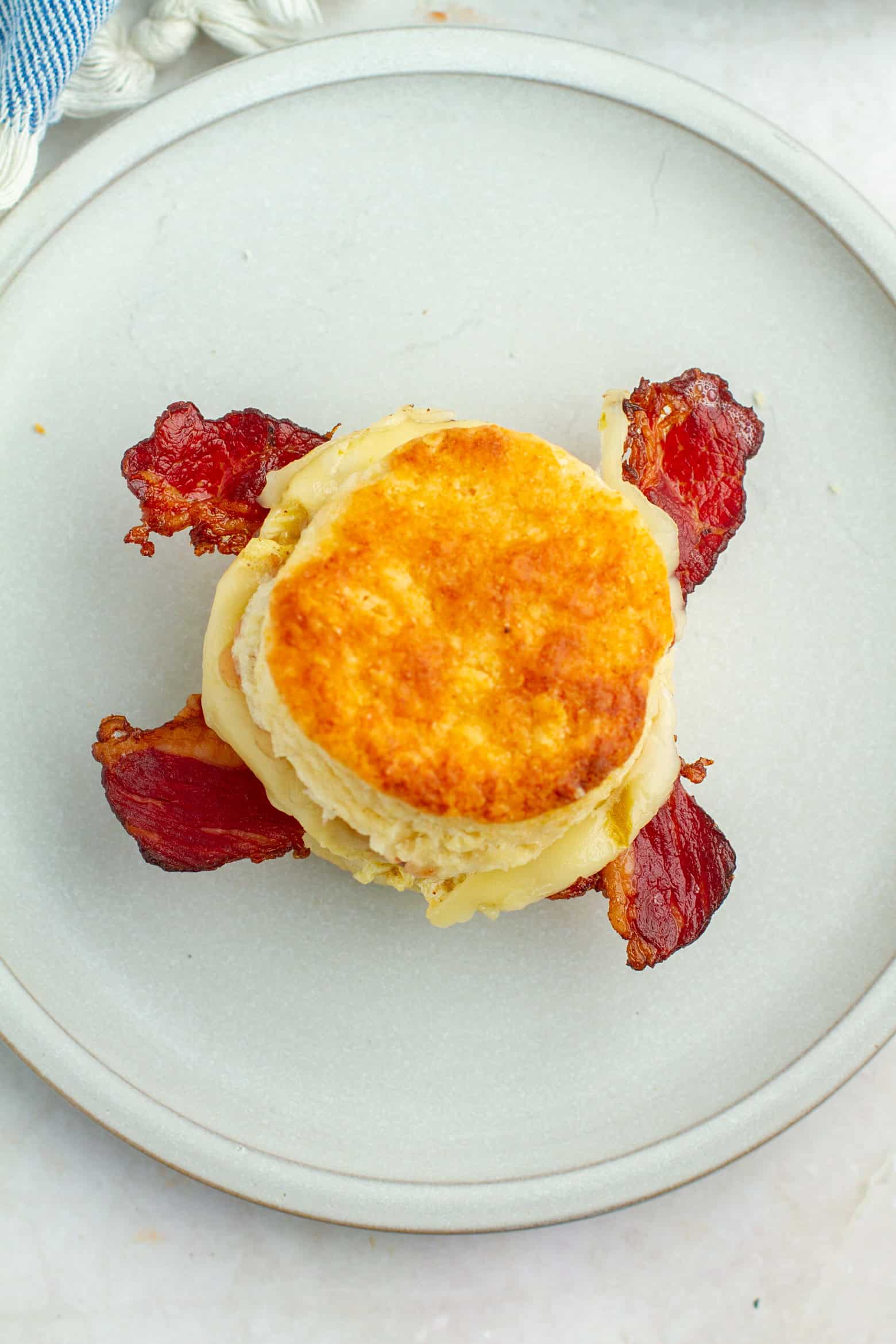 overhead shot of bacon egg and cheese biscuits.