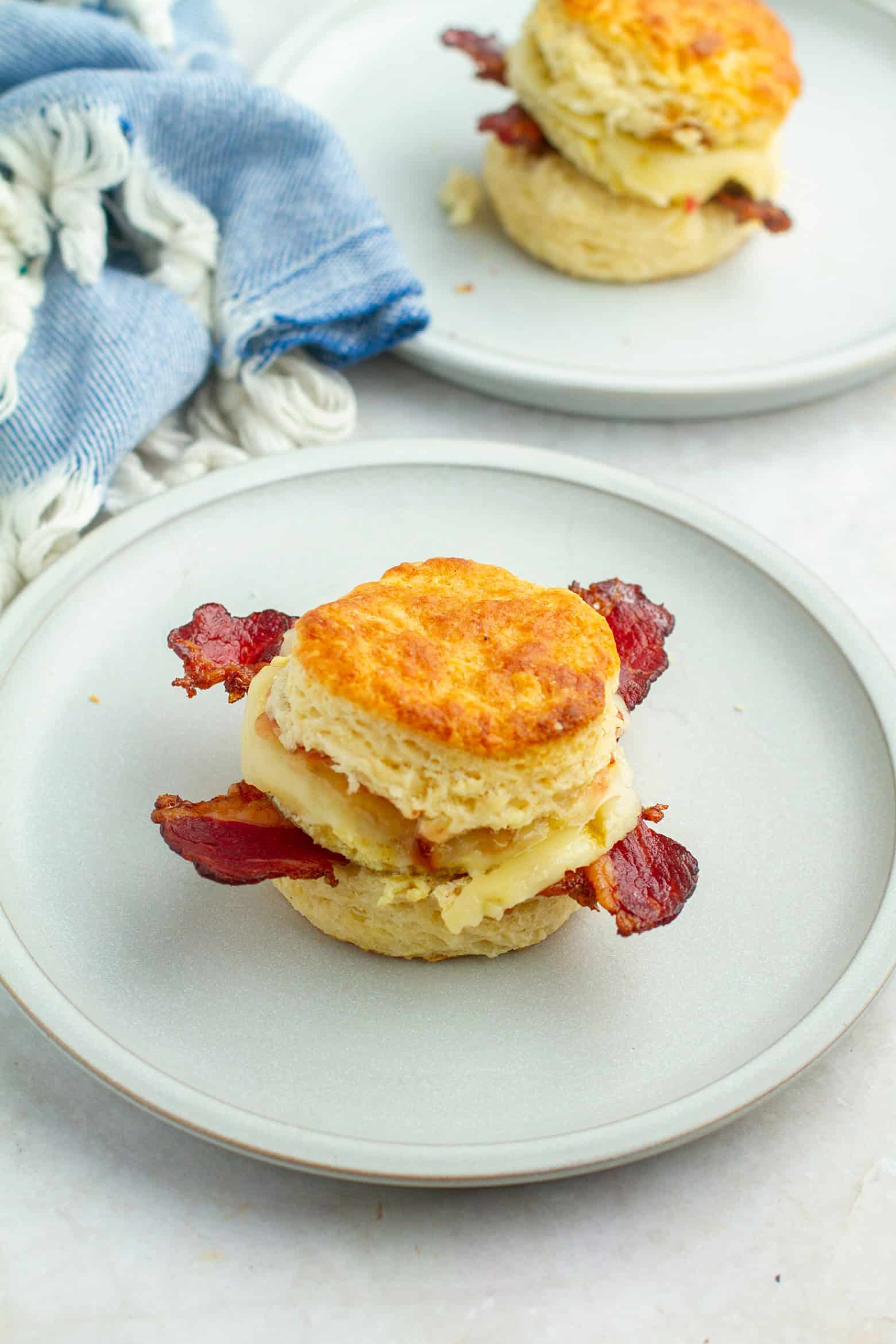 bacon egg and cheese biscuits on a plate.