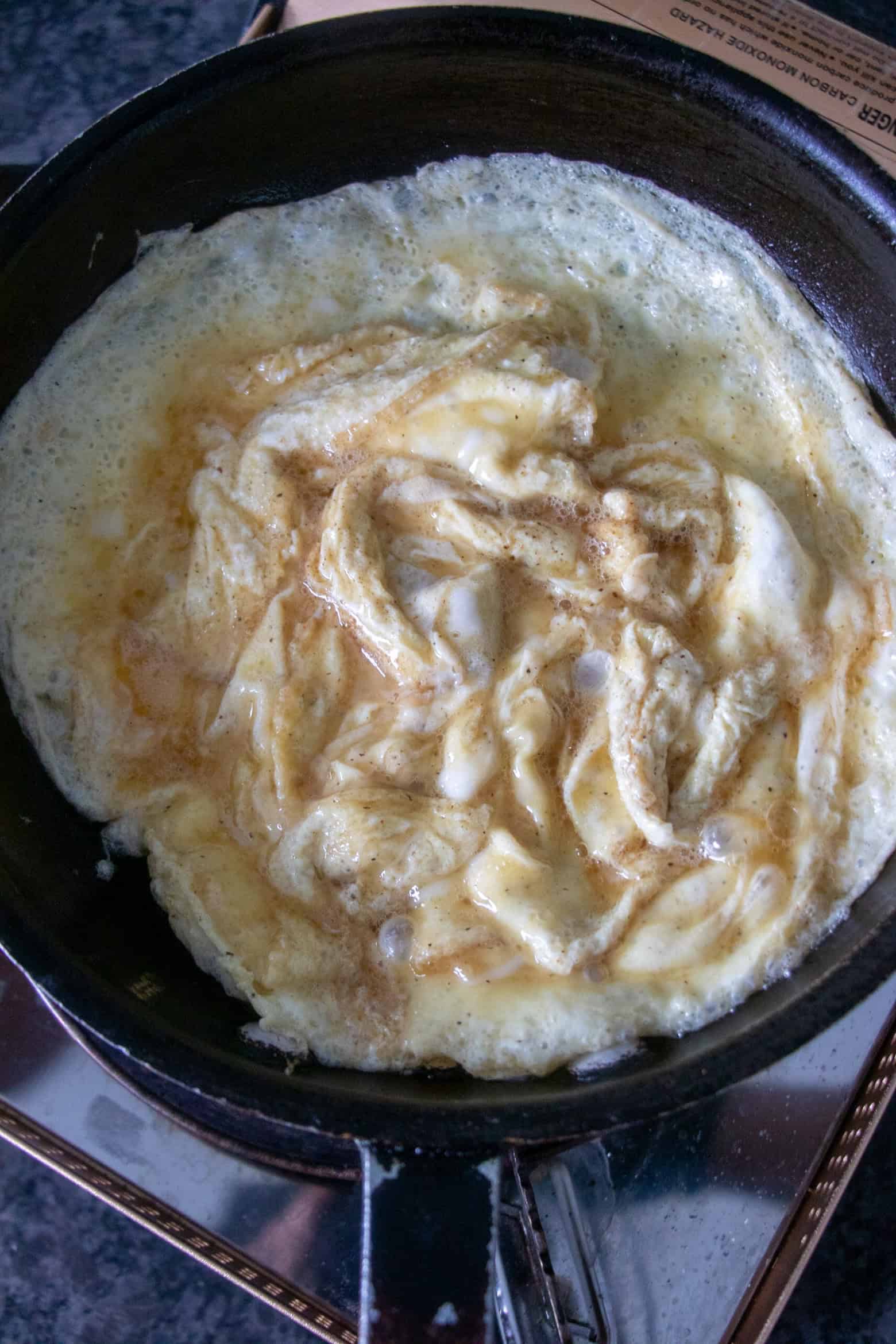 eggs cooking in a skillet.