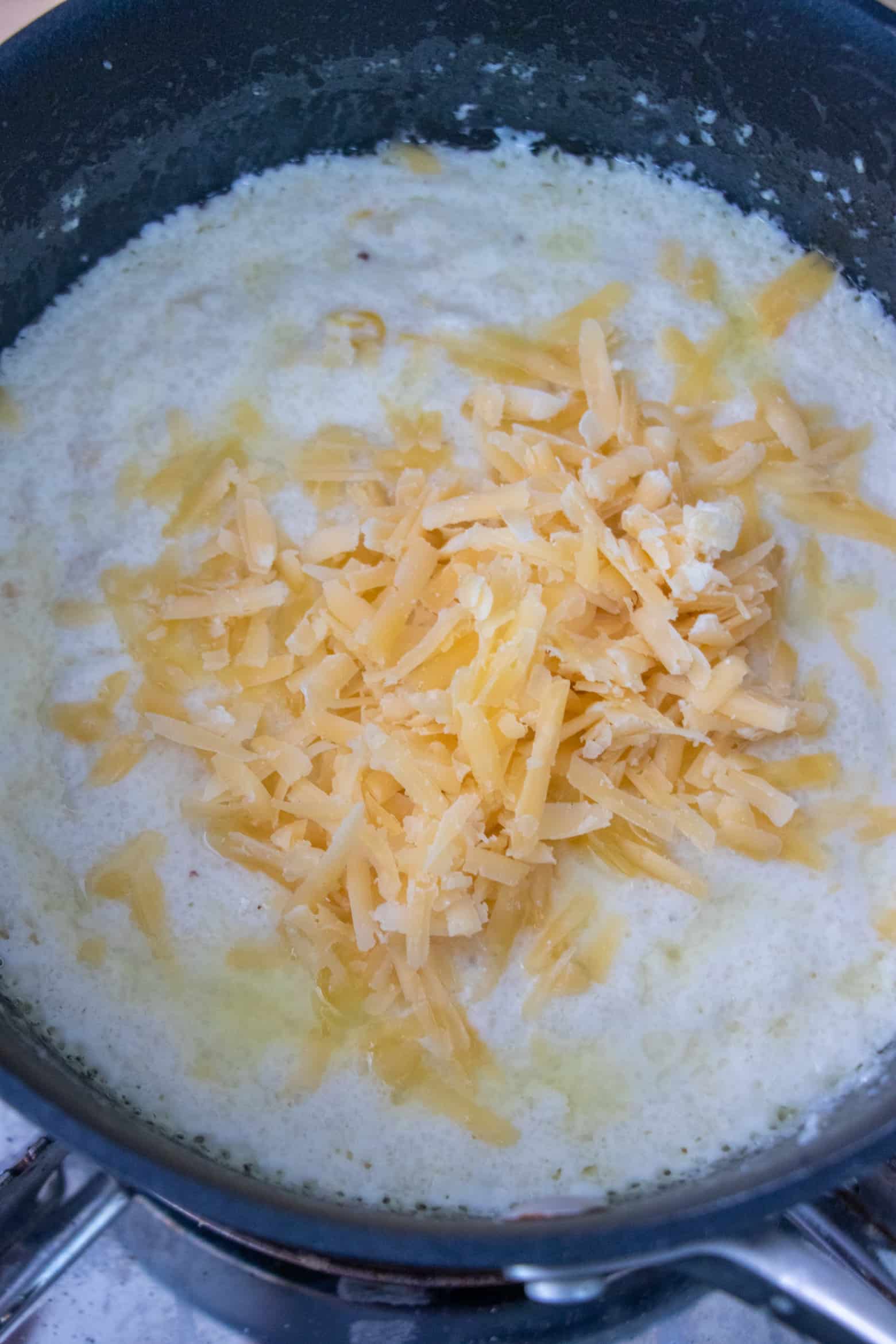 smoked gouda cheese added to boiling cream.