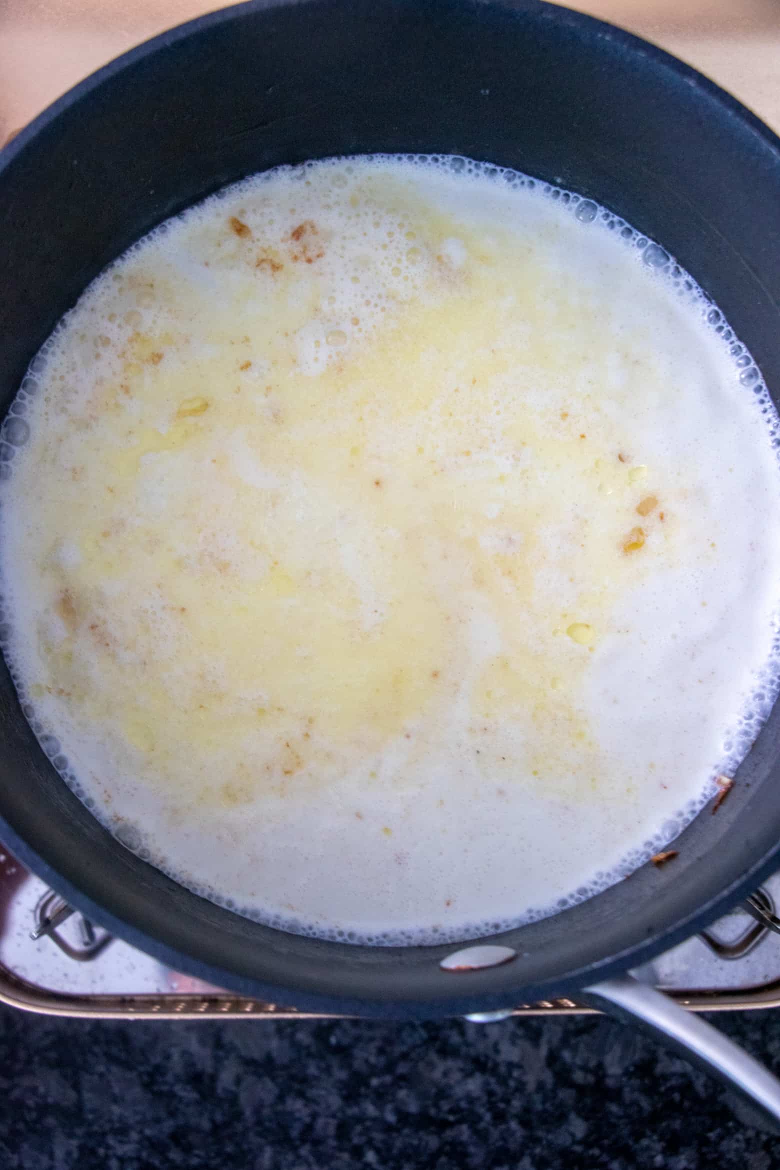 Heavy cream, butter, and water in a pot.