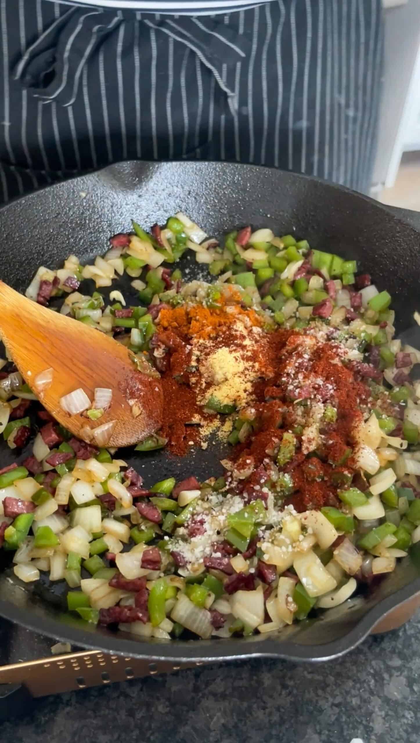 Garlic and seasonings added to the skillet.