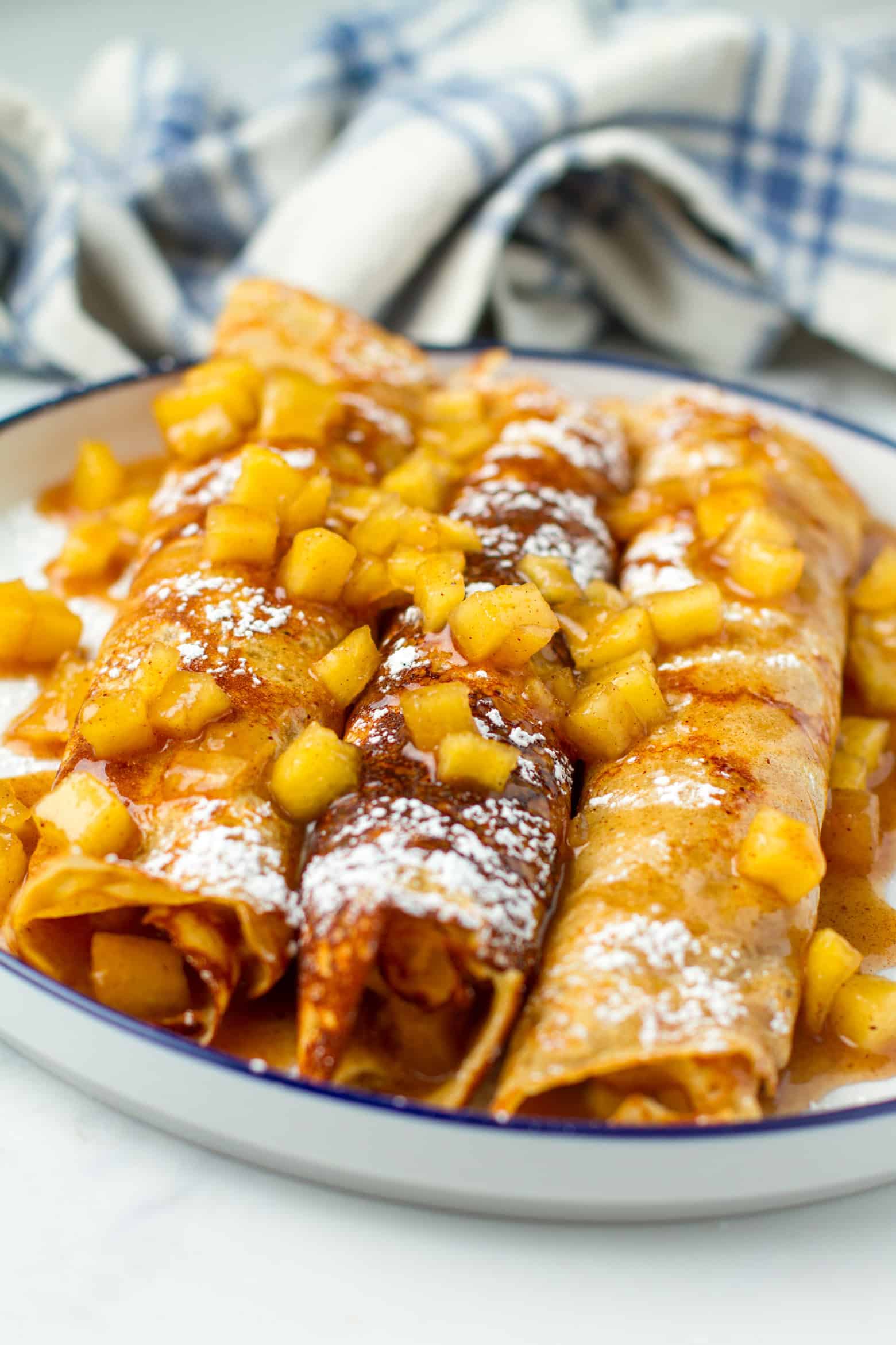 apple crepes on a plate.
