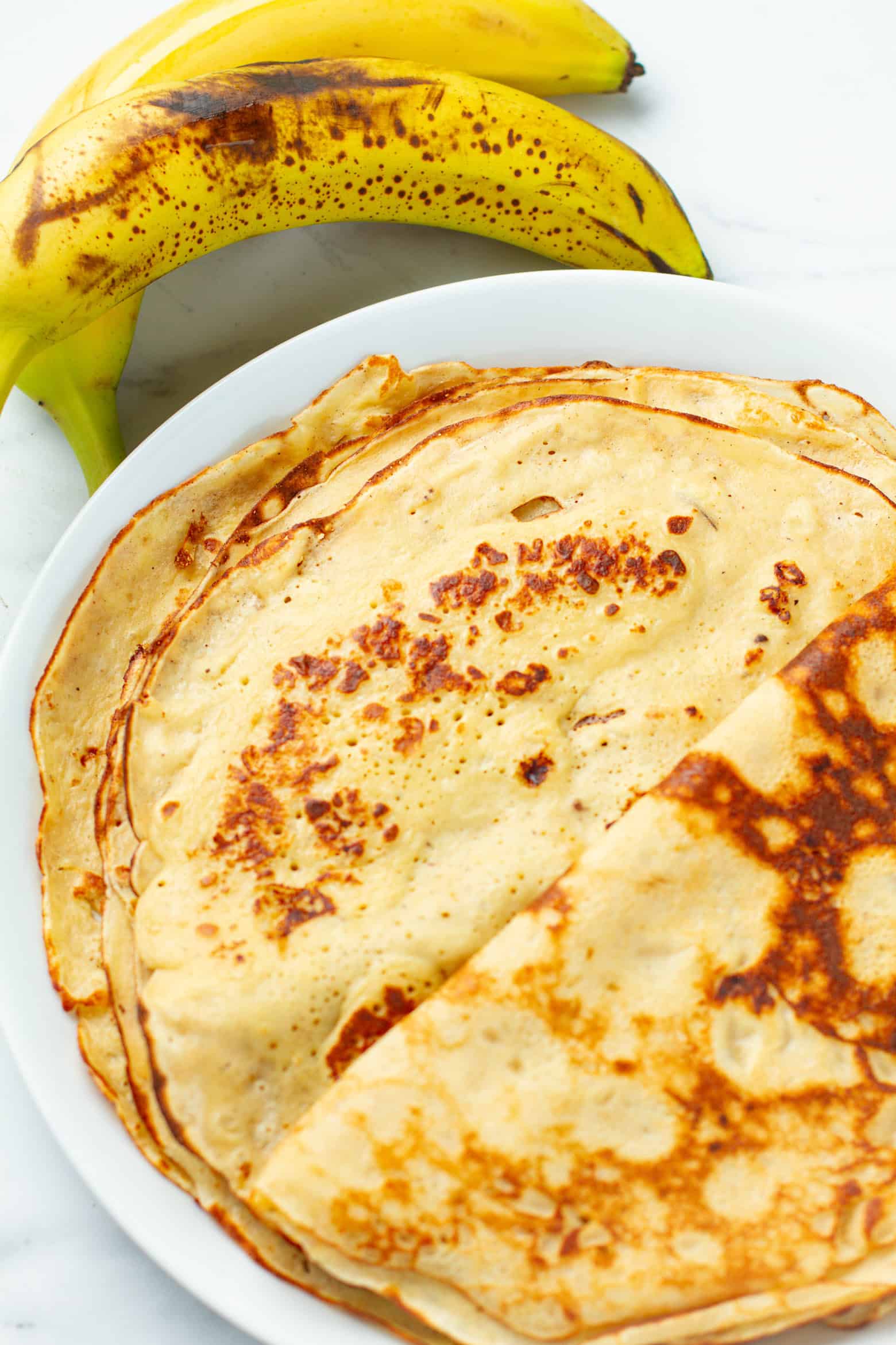 banana crepes on a plate.