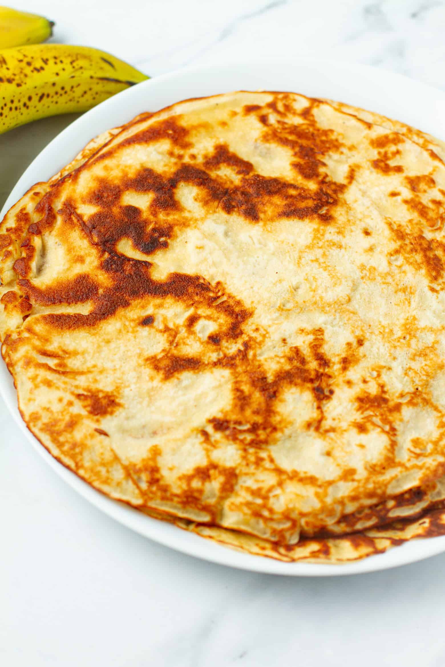 banana crepes on a plate.