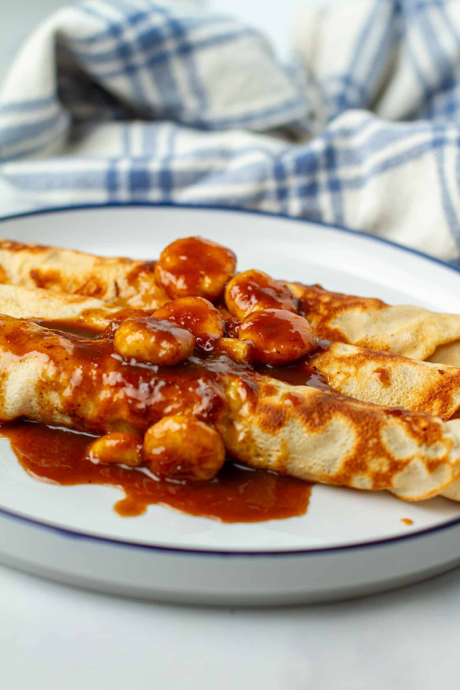 Banana Foster Crepes on a plate.