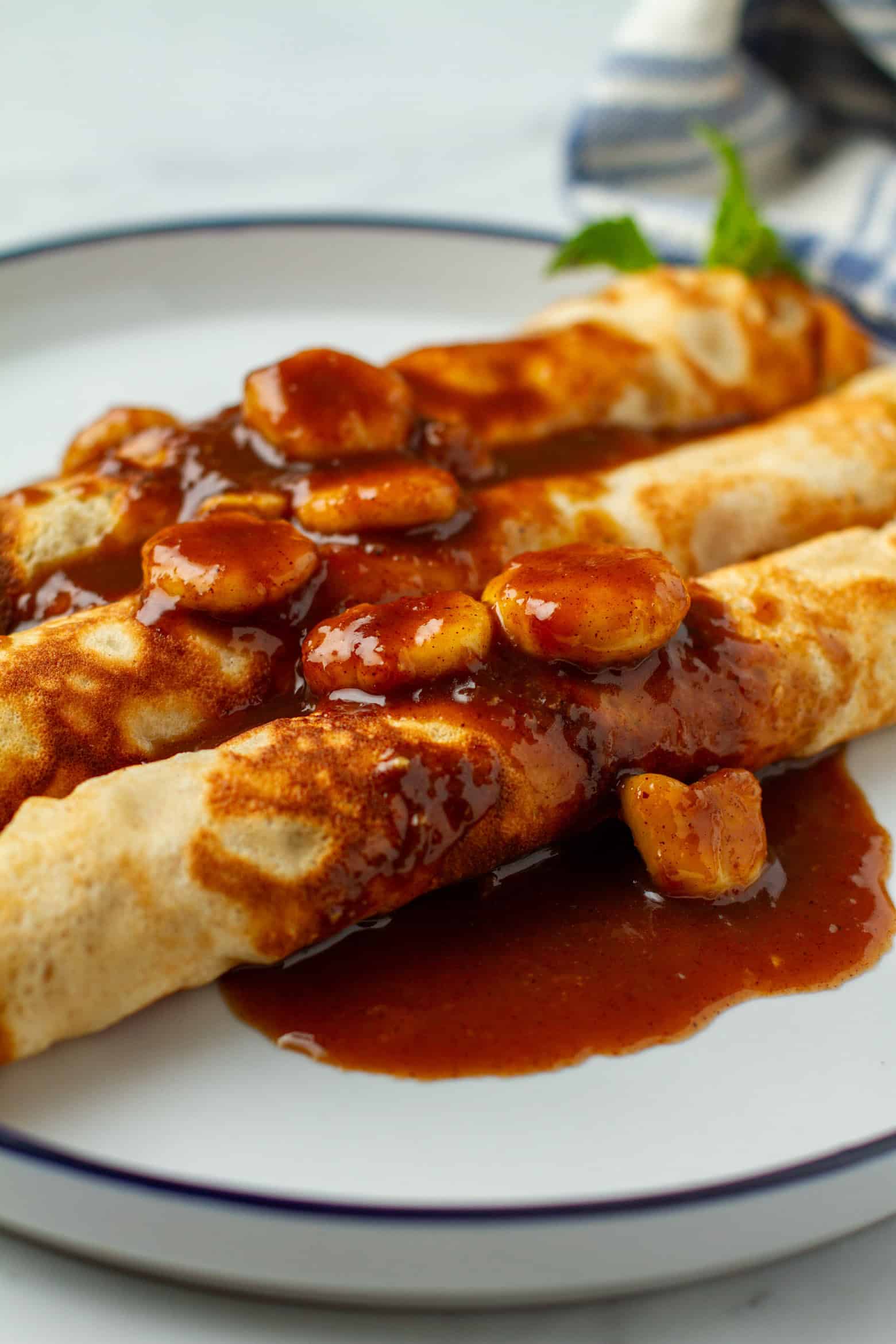 Banana Foster Crepes on a plate.